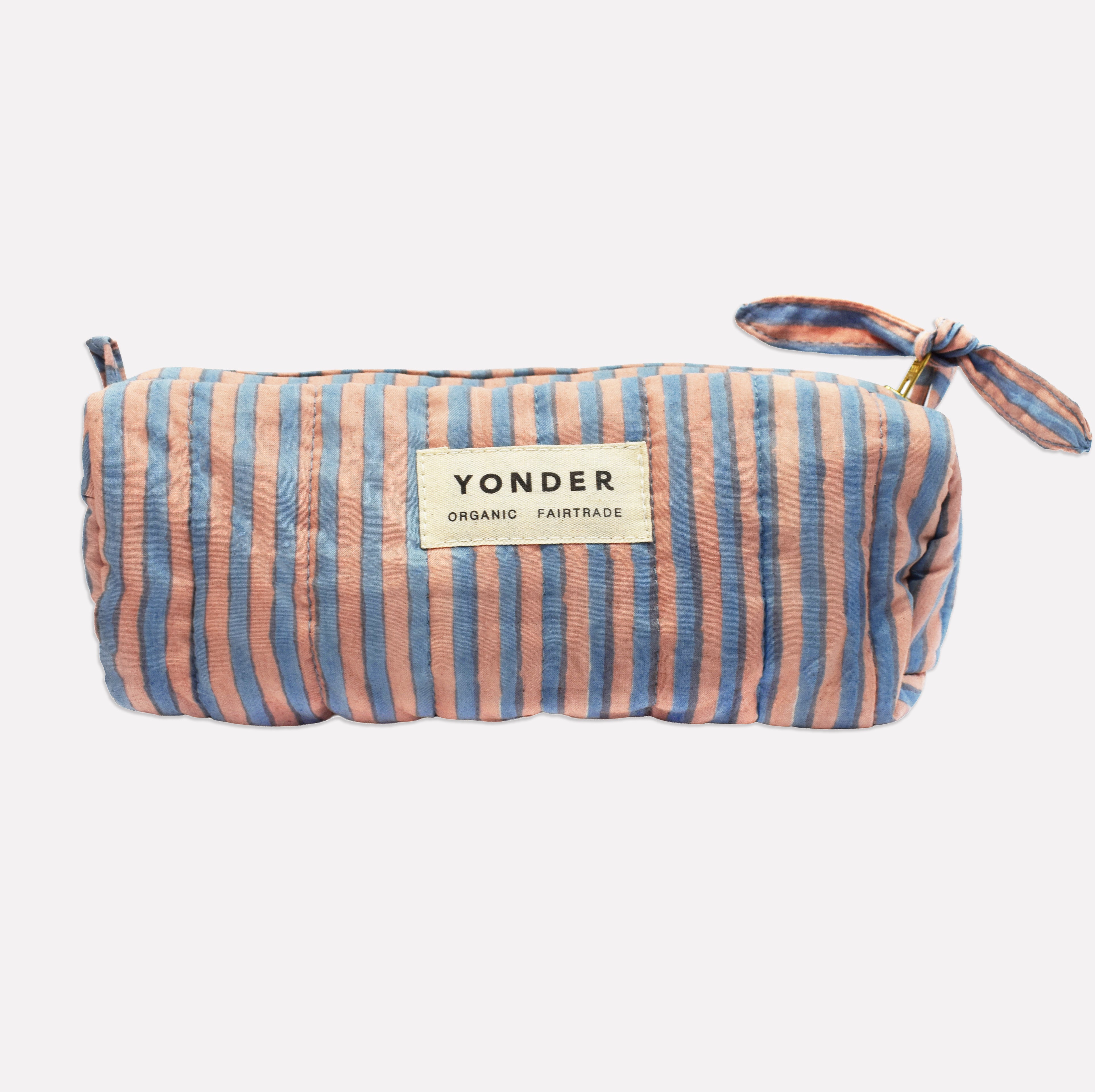Yonder soft organic cotton brioche wash bag in blue and tan candy stripe with brass zip, hand block-printed in Jaipur