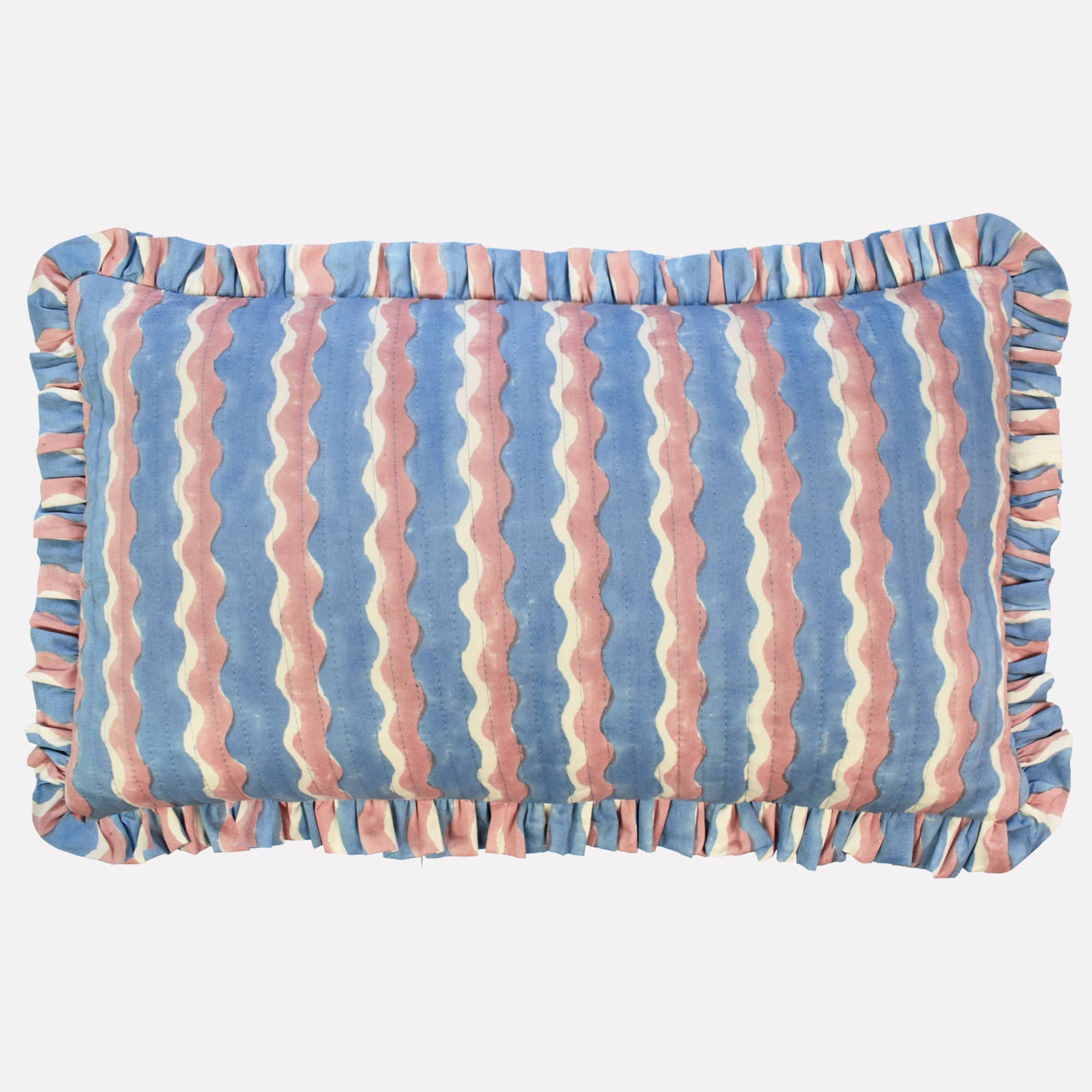 Cotton quilted cushion printed with blue and pink striped wave pattern and frill border