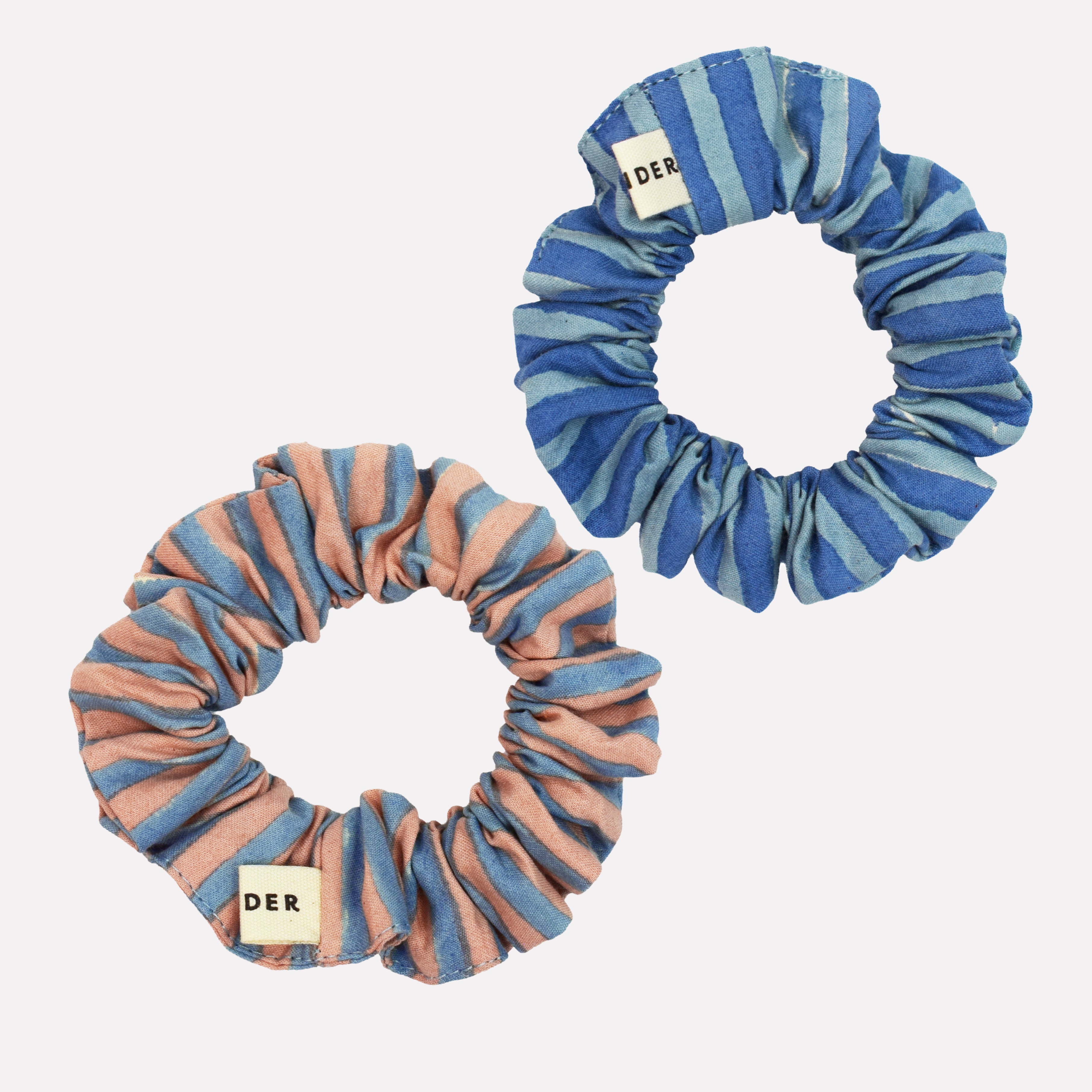 Two cotton mini scrunchies printed with blue and tan striped pattern