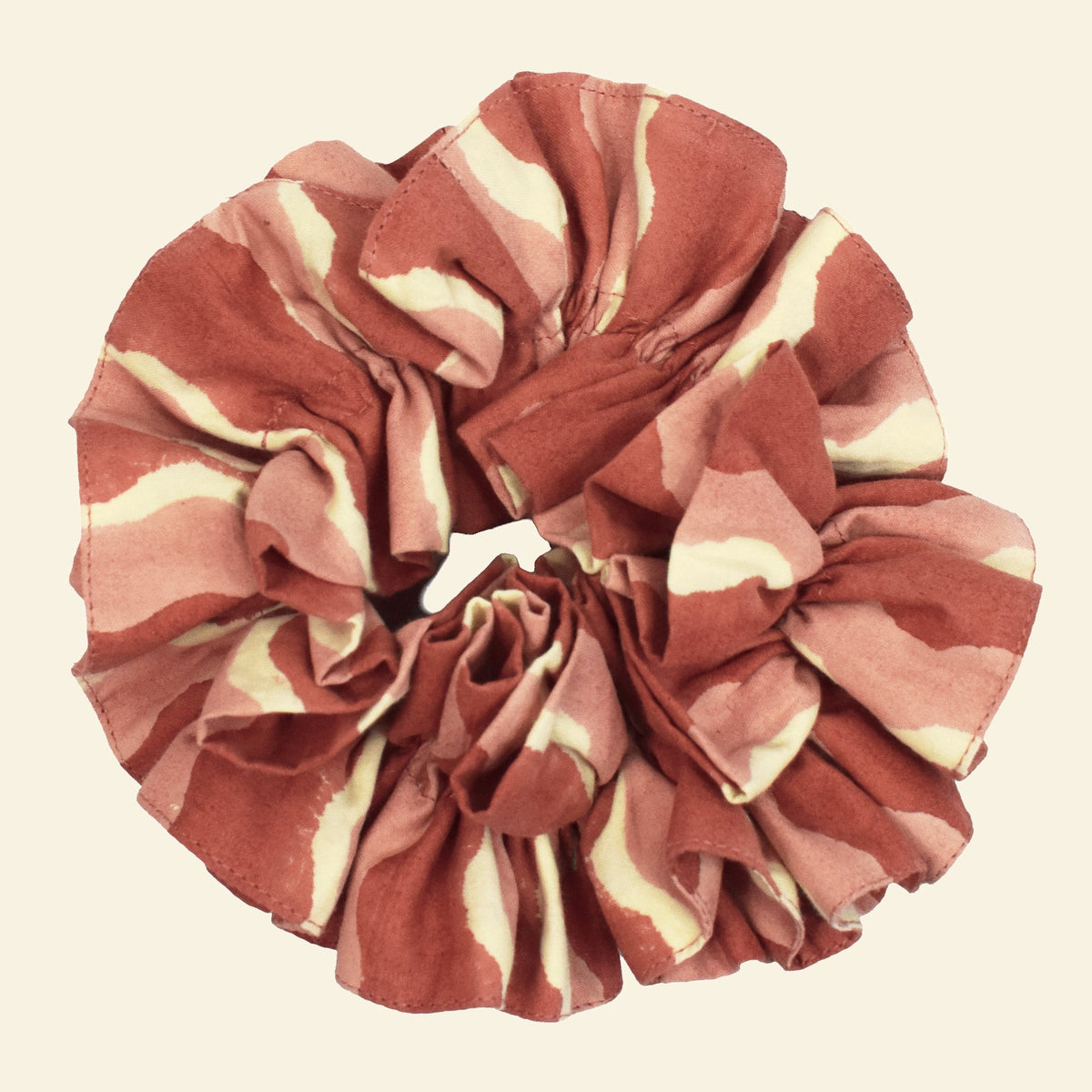 Yonder organic cotton ruffle scrunchie in ginger-red and pink wave-stripe, hand block-printed in Jaipur