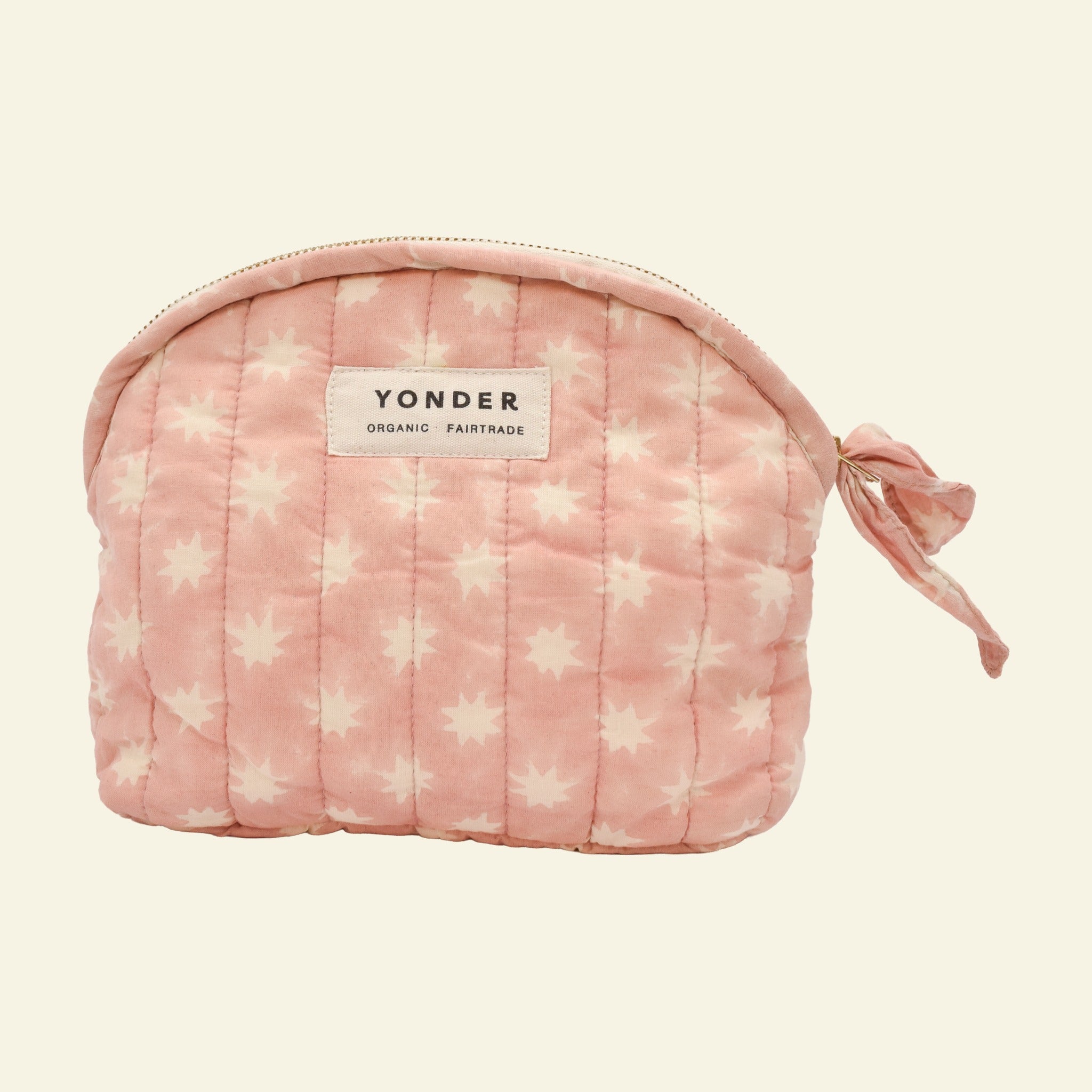 Yonder organic cotton quilted zip pouch in blush pink Cosmic star print, with brass zip, hand block-printed in Jaipur