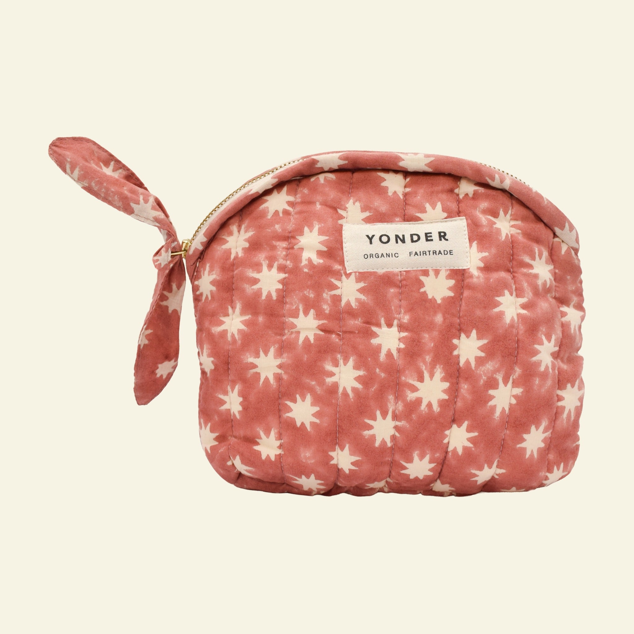 Yonder organic cotton quilted zip pouch in ginger Cosmic star print, with brass zip, hand block-printed in Jaipur
