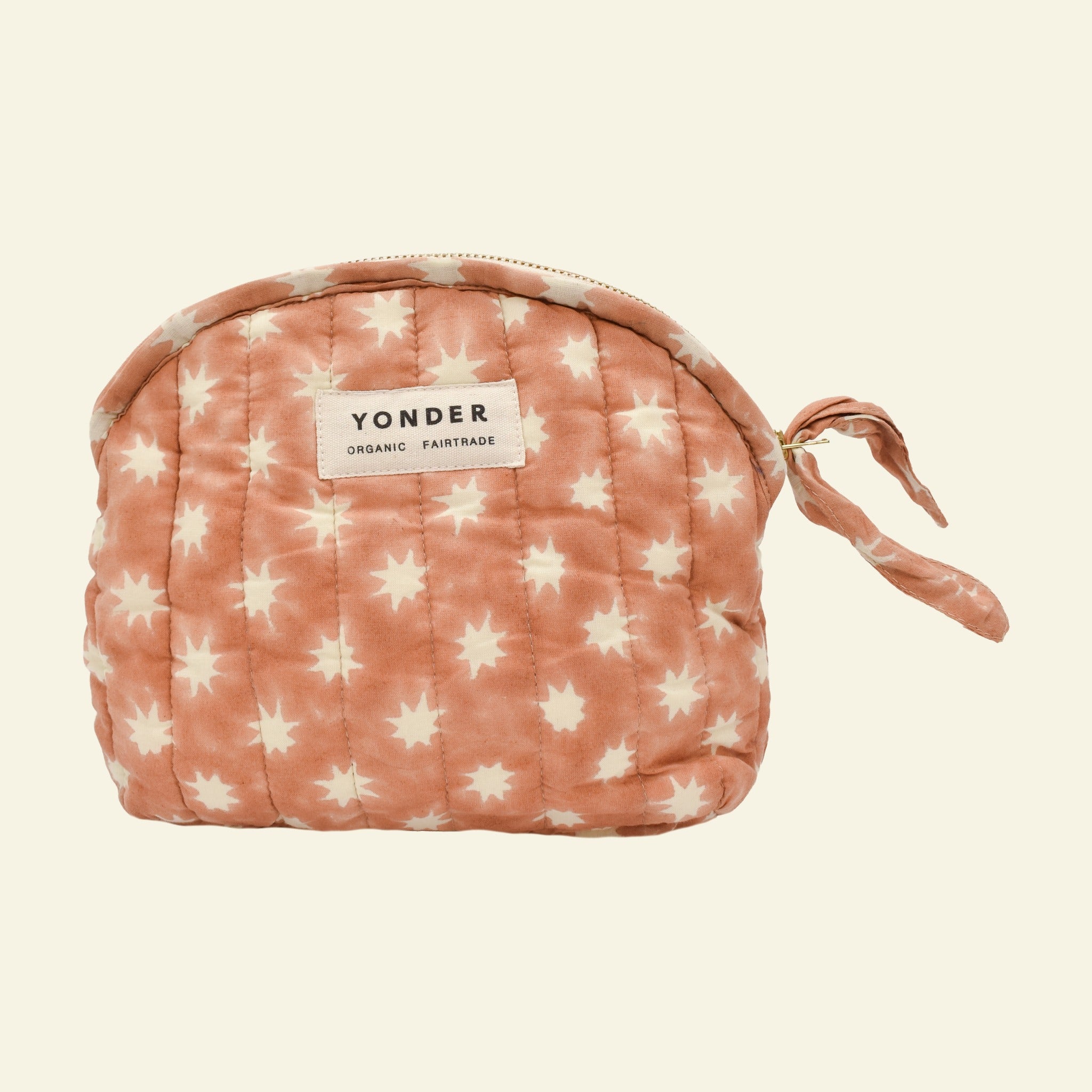 Yonder organic cotton quilted zip pouch in peanut brown Cosmic star print, with brass zip, hand block-printed in Jaipur