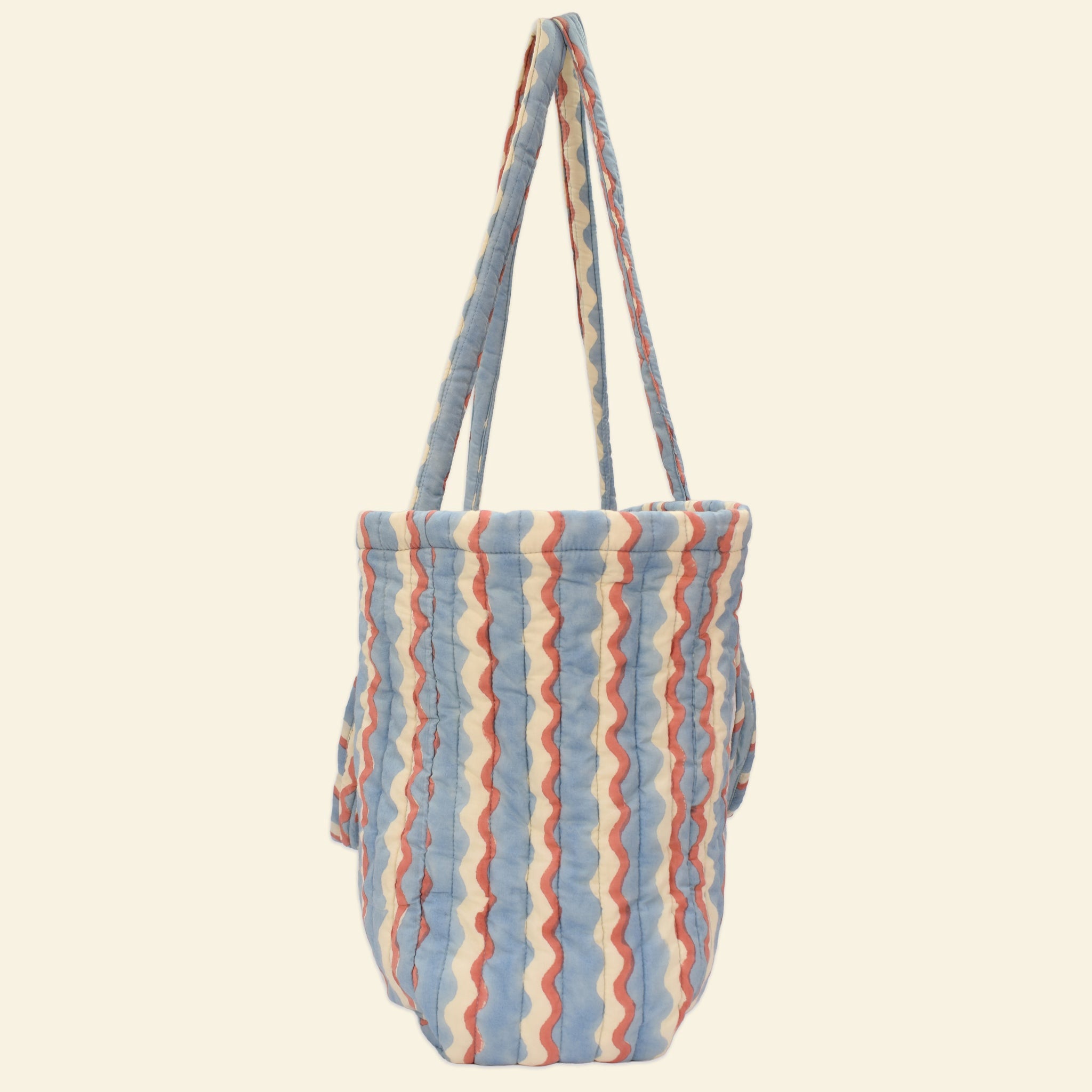Side view of Yonder sky-blue wiggle wave Carry All tote, quilted organic cotton, hand block-printed