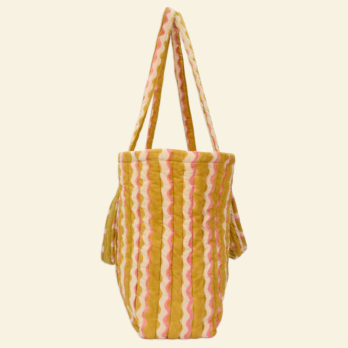 Side view of Yonder honey wiggle Carry All tote, quilted organic cotton, hand block-printed