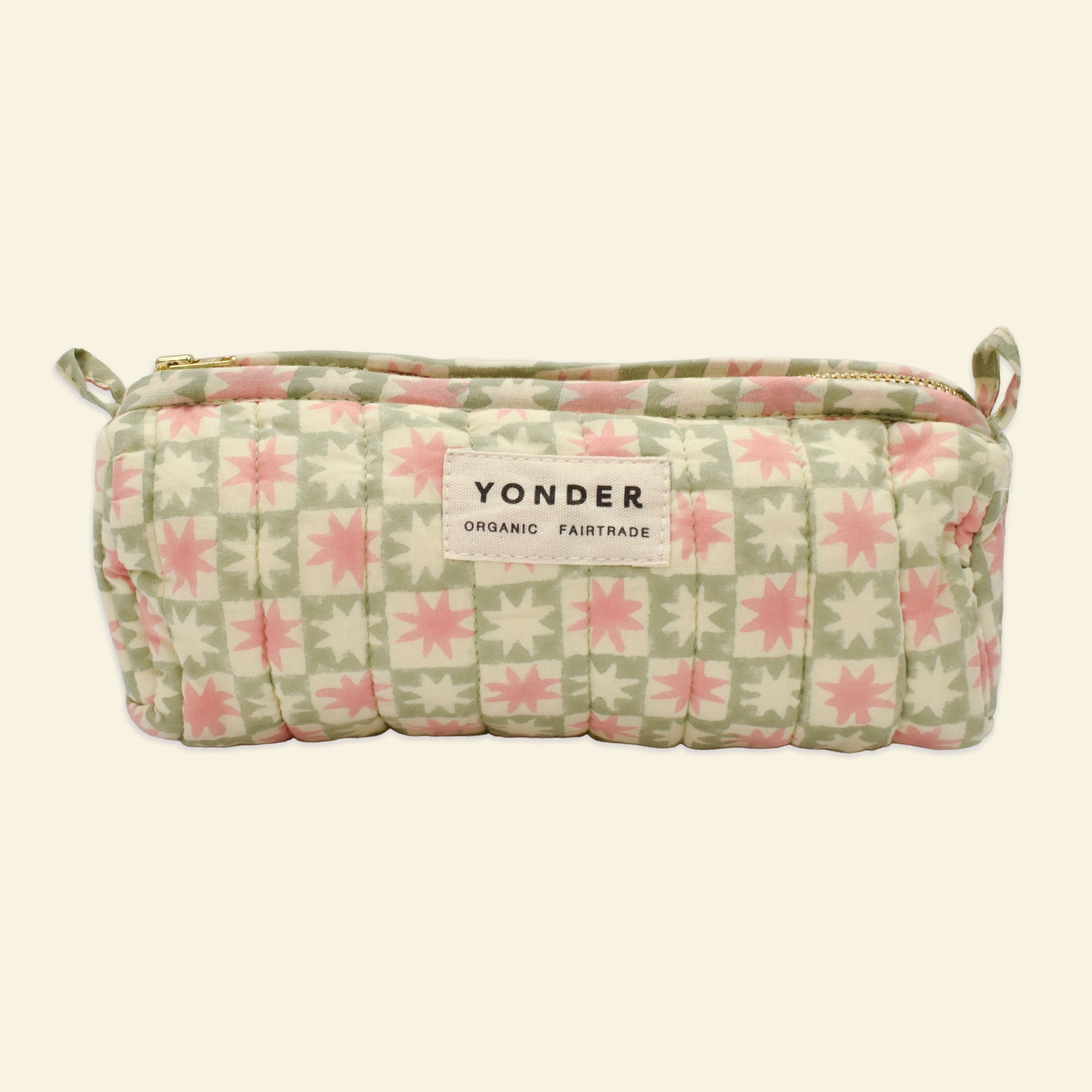 Yonder soft organic cotton brioche wash bag in peppermint green pinwheel star print with brass zip, hand block-printed in Jaipur