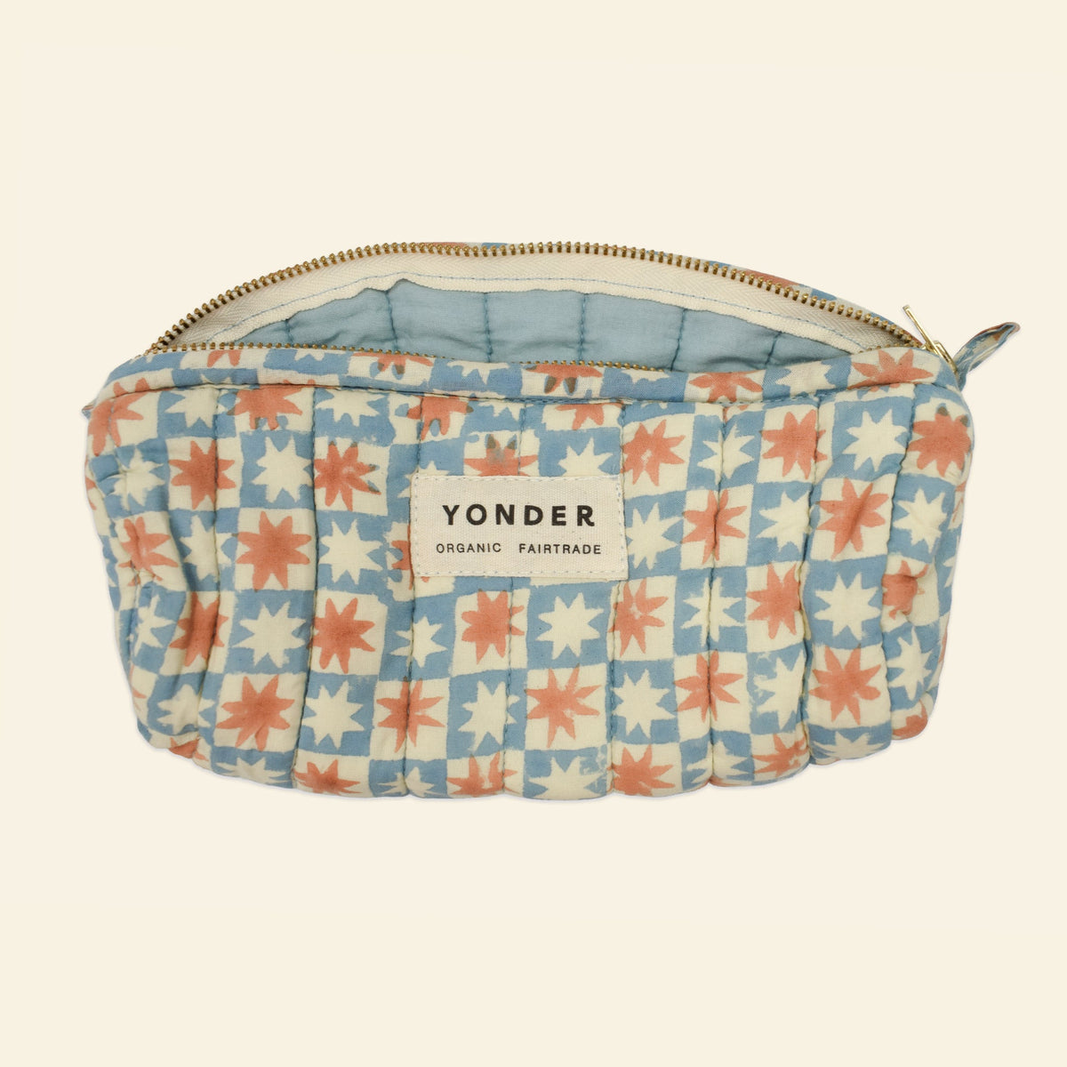 Yonder soft organic cotton brioche wash bag in sky-blue pinwheel star print, open, hand block-printed in Jaipur