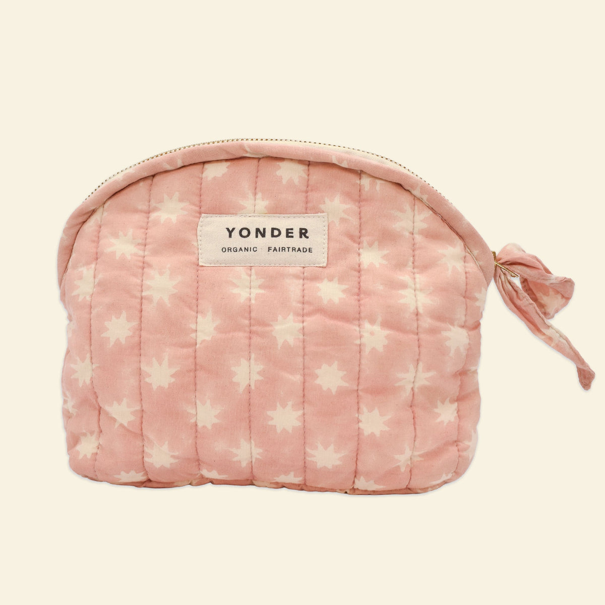 Cotton quilted zip pouch printed with pink and white star pattern