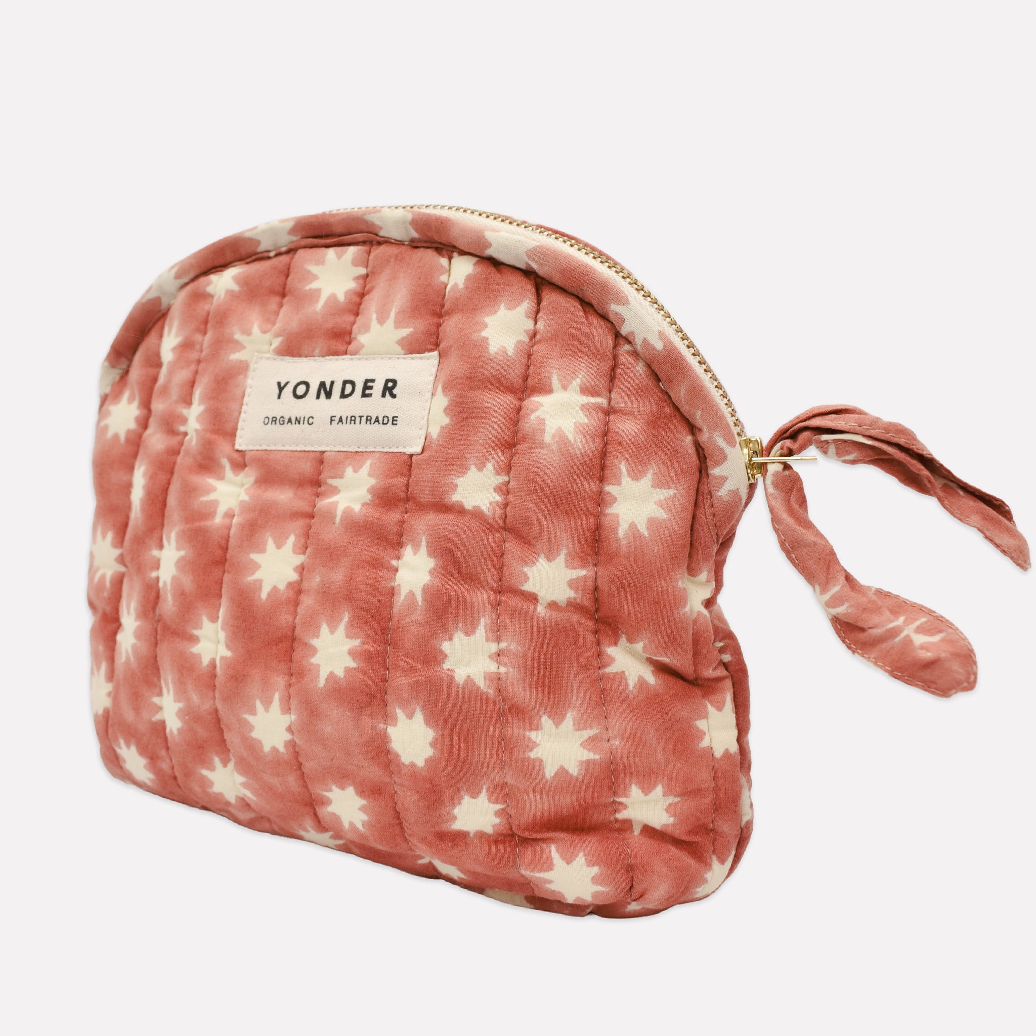 Cotton quilted zip pouch printed with red and white star pattern
