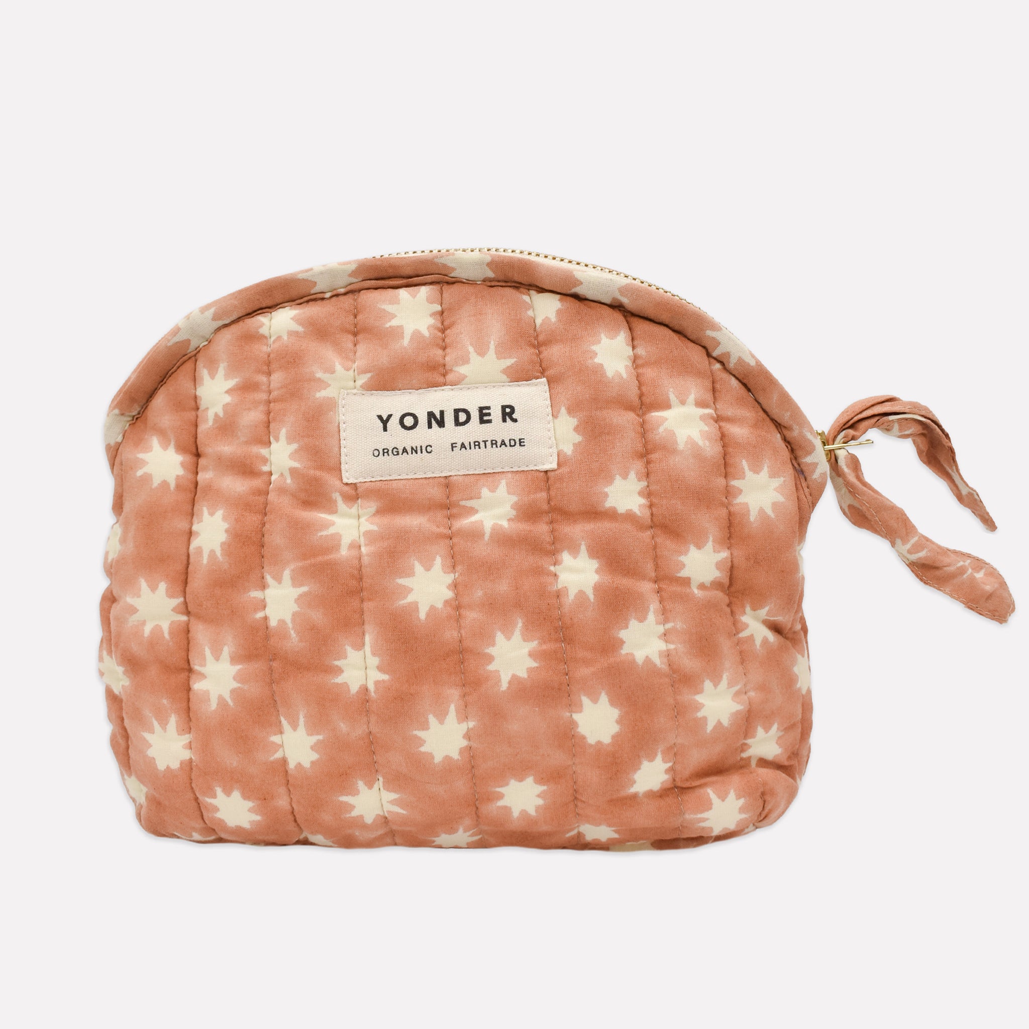 Cotton quilted zip pouch printed with peach and white star pattern