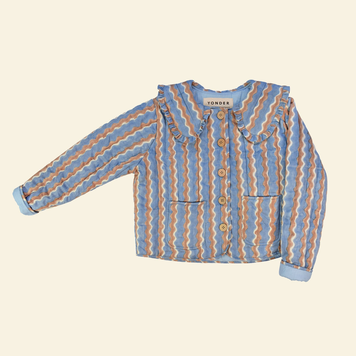 Cotton quilted jacket printed with blue and brown striped wave pattern and frill collar