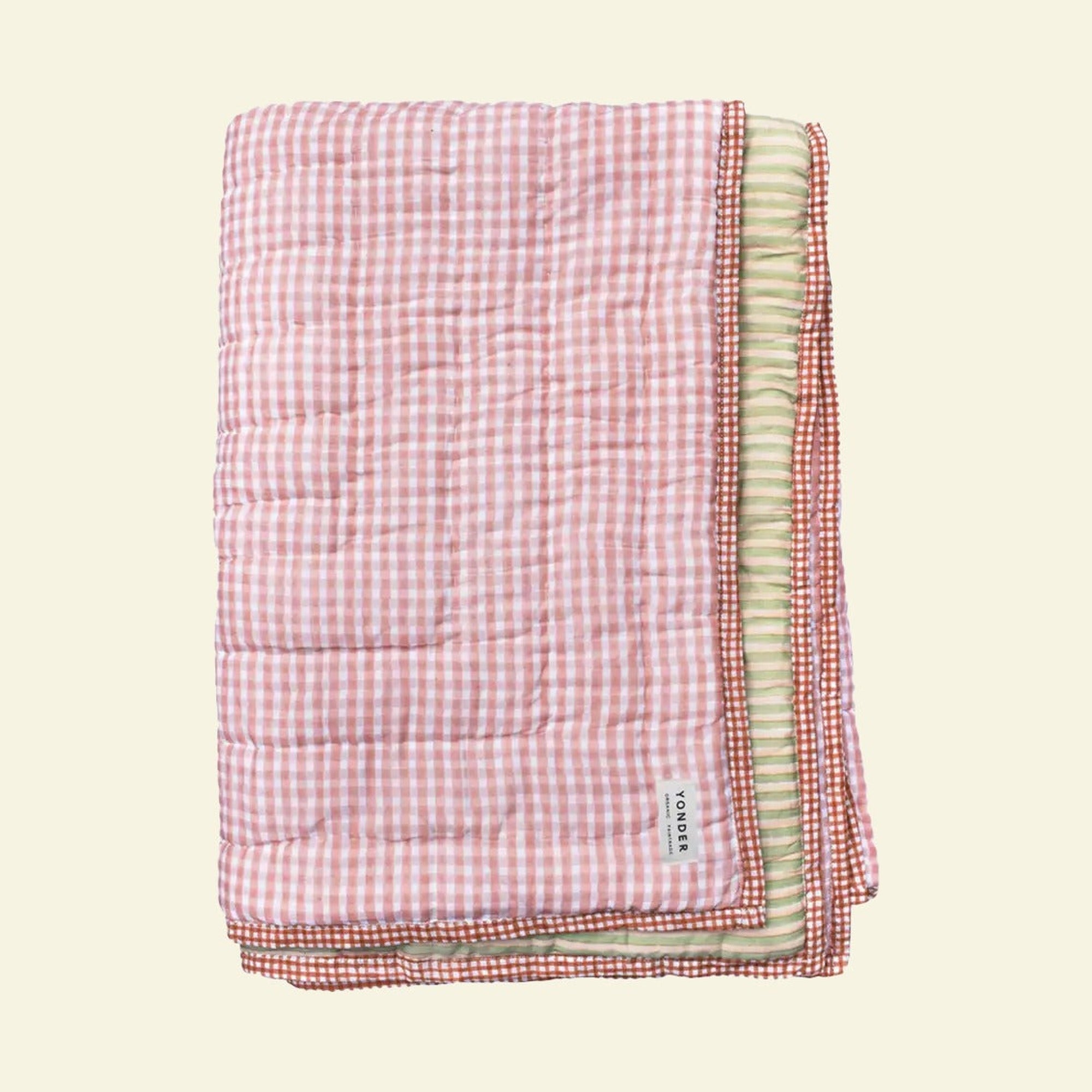 Yonder quilt on a cream background