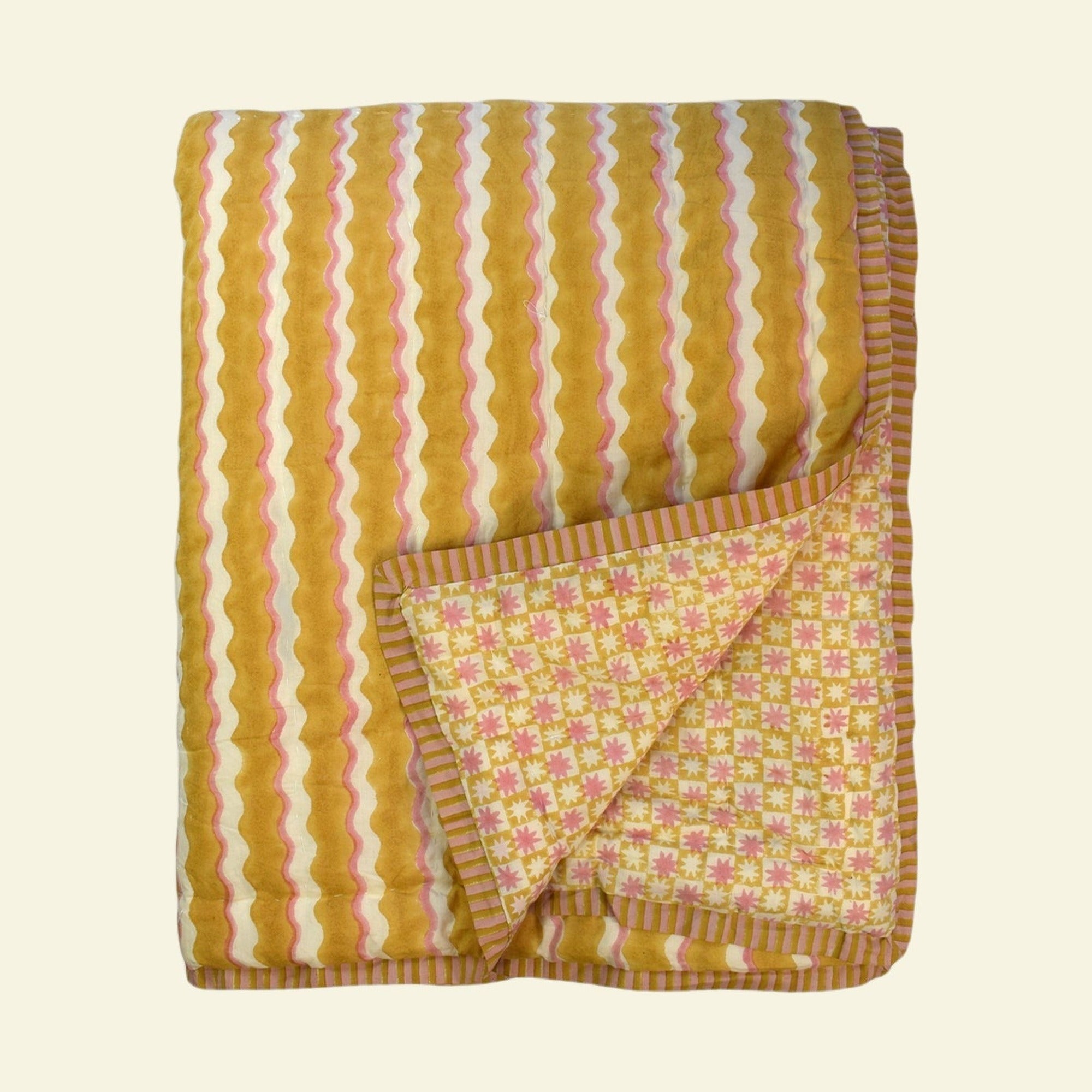 Yonder quilt on a cream background
