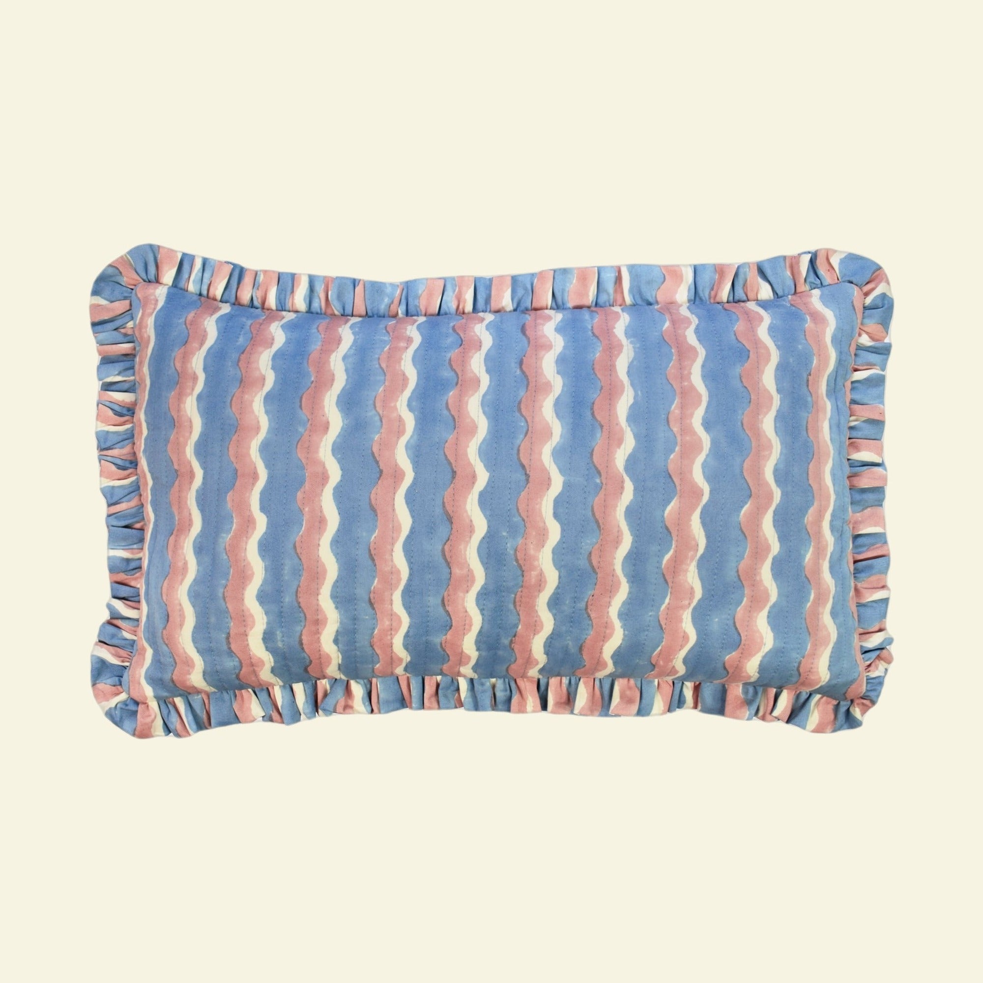 Yonder Living hand block-printed organic cotton quilted frill cushion in Whirly blueberry, cool blue and soft neutral waves, small