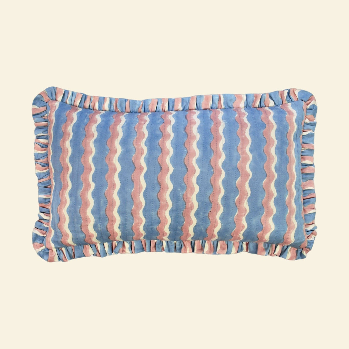 Yonder Living hand block-printed organic cotton quilted frill cushion in Whirly blueberry, cool blue and soft neutral waves, small