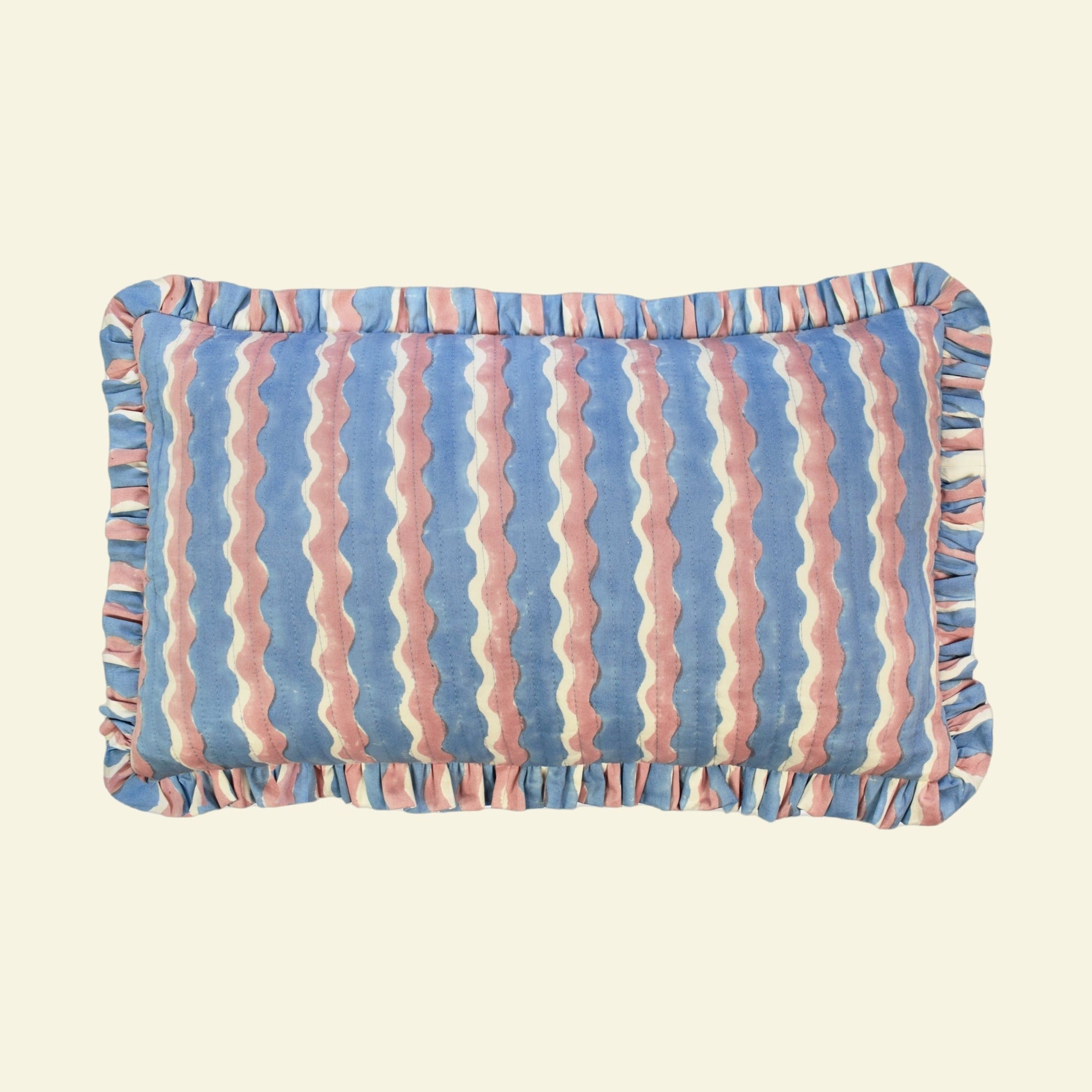 Yonder Living organic cotton quilted frill cushion in Whirly blueberry block print, cool blue and neutral waves with frilled edge, medium