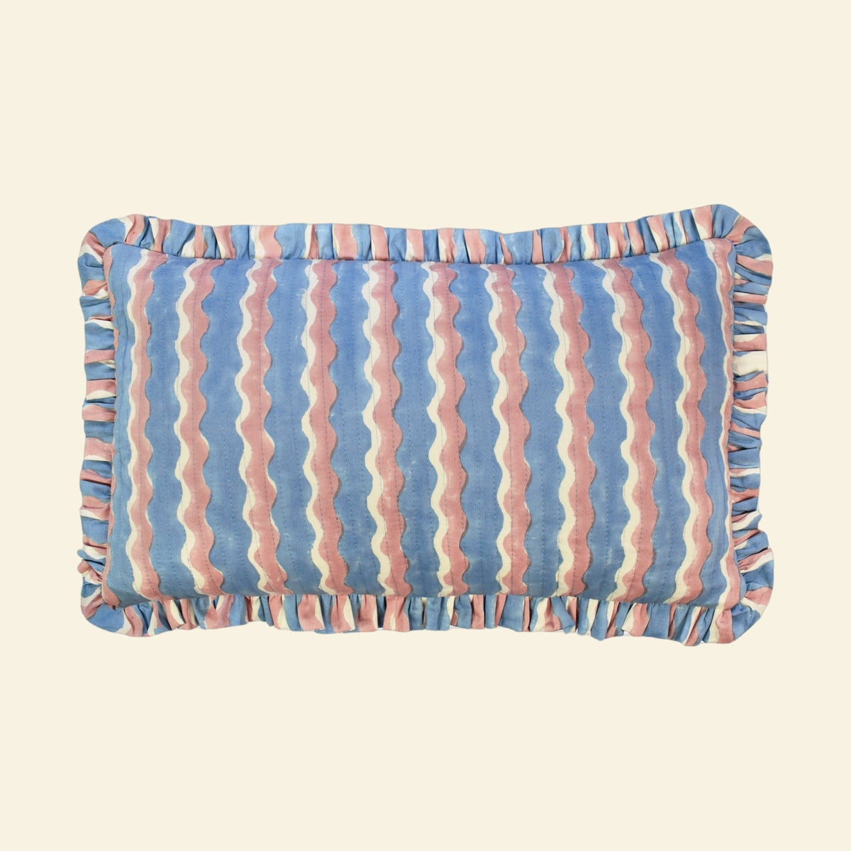 Yonder Living organic cotton quilted frill cushion in Whirly blueberry block print, cool blue and neutral waves with frilled edge, medium