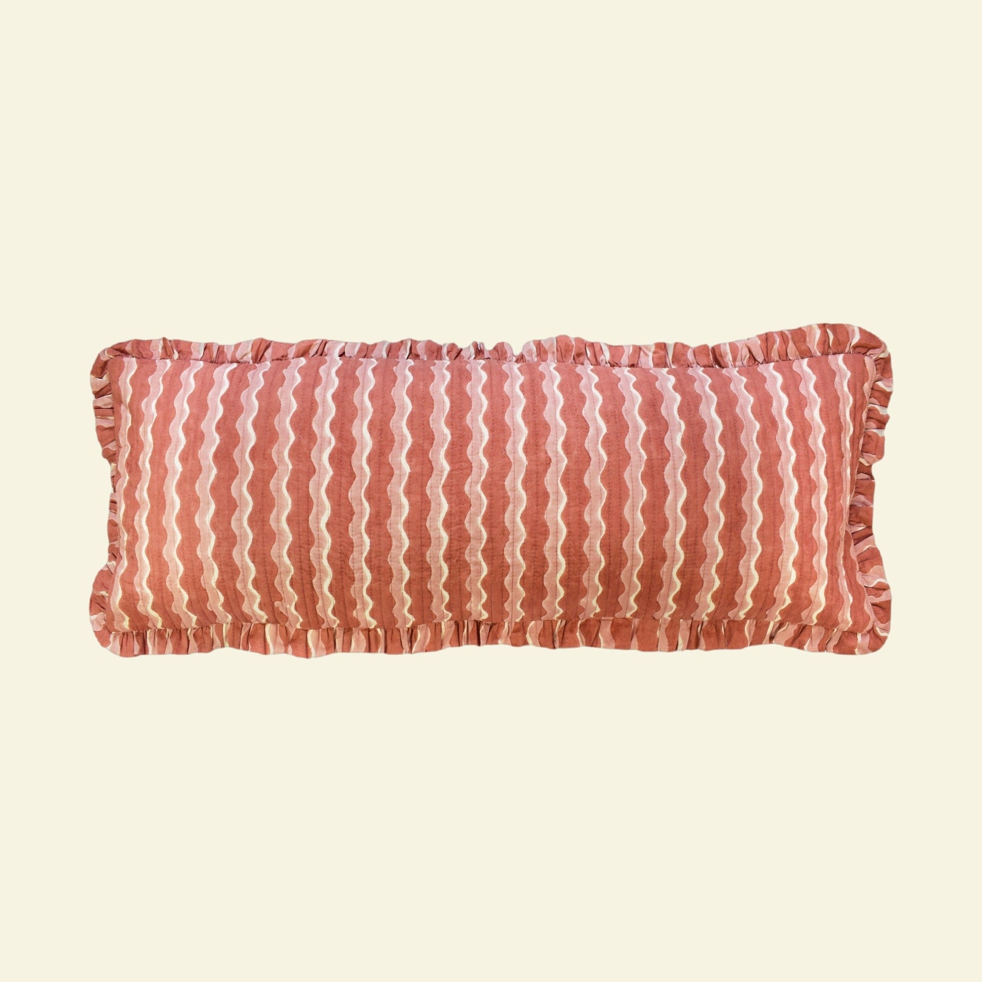 Yonder Living long bolster quilted frill cushion in Whirly ginger block print, warm ginger and cream waves, hand-printed in Jaipur