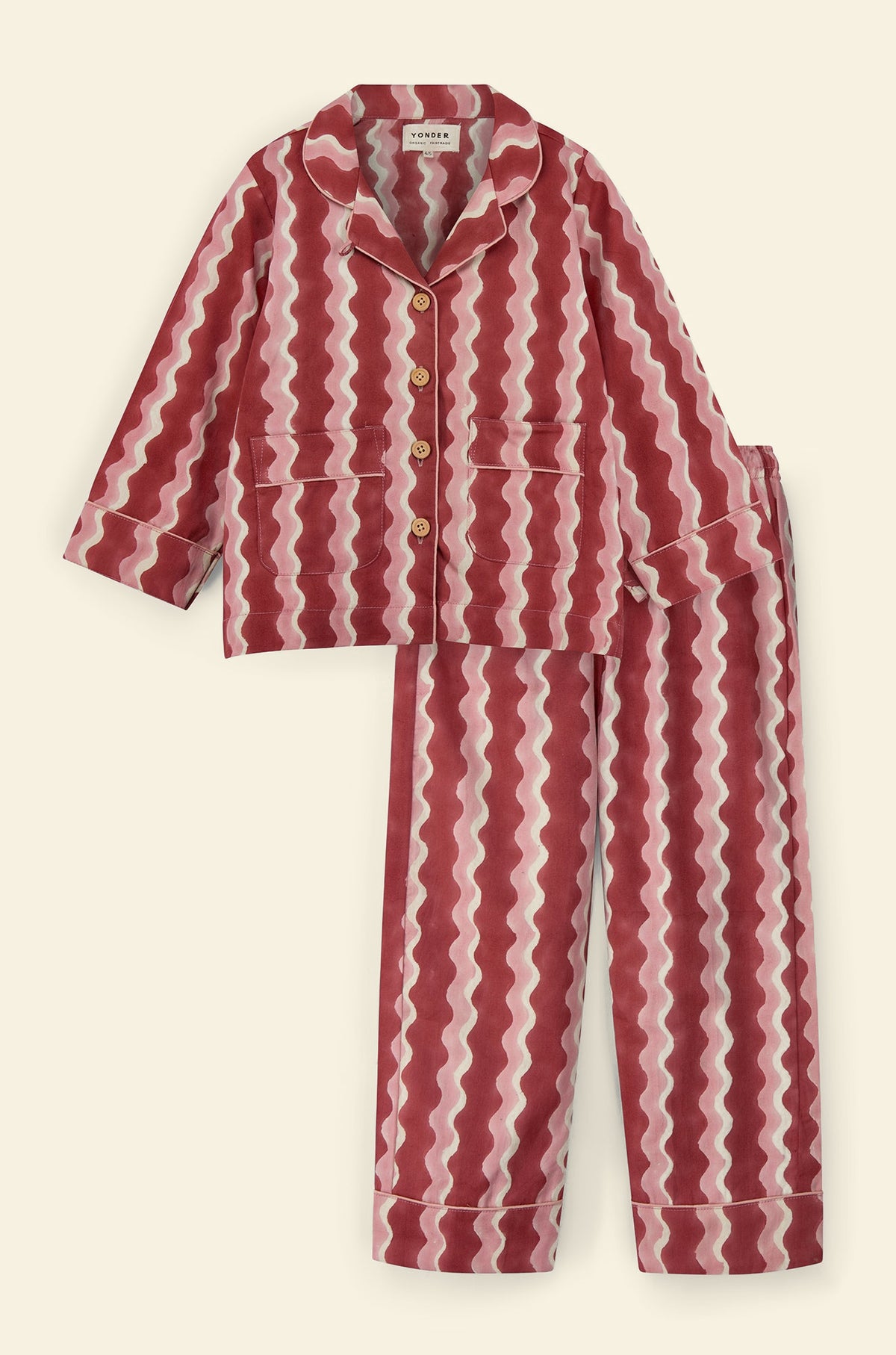 Cotton kids’ pajama set printed with red and pink striped wave pattern