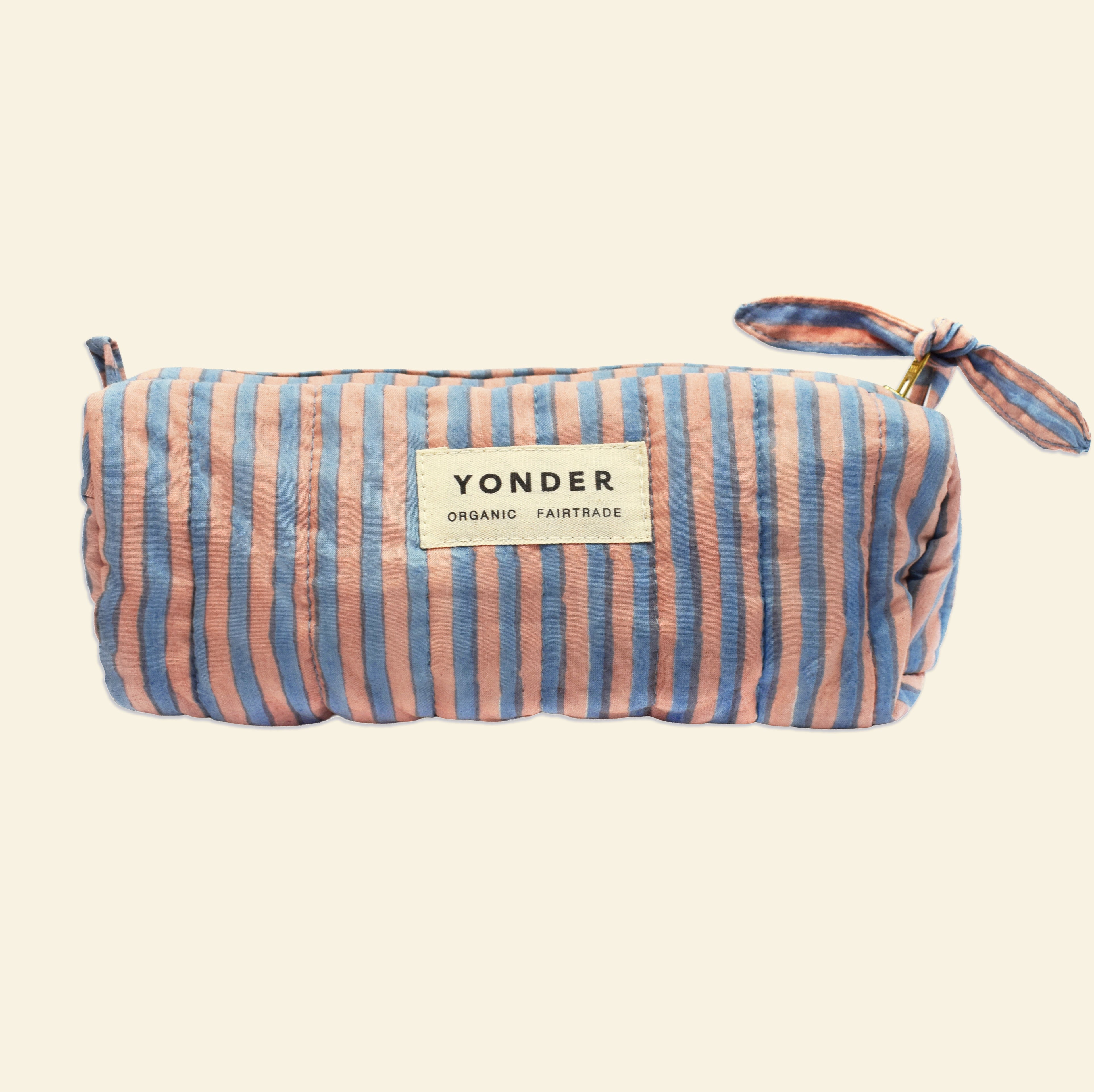 Yonder soft organic cotton brioche wash bag in blue and tan candy stripe with brass zip, hand block-printed in Jaipur