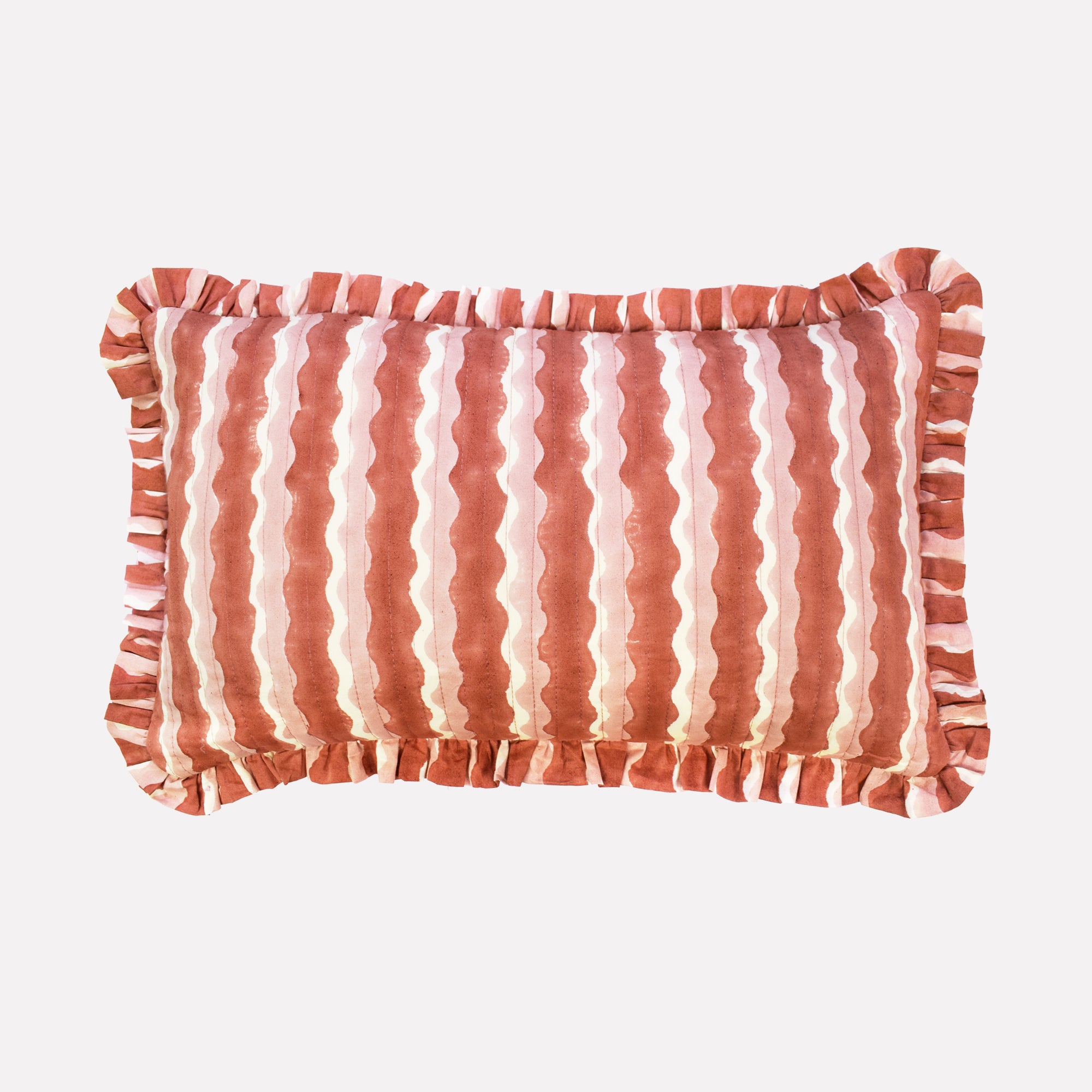 Small cotton quilted cushion printed with pink striped wave pattern and frill border