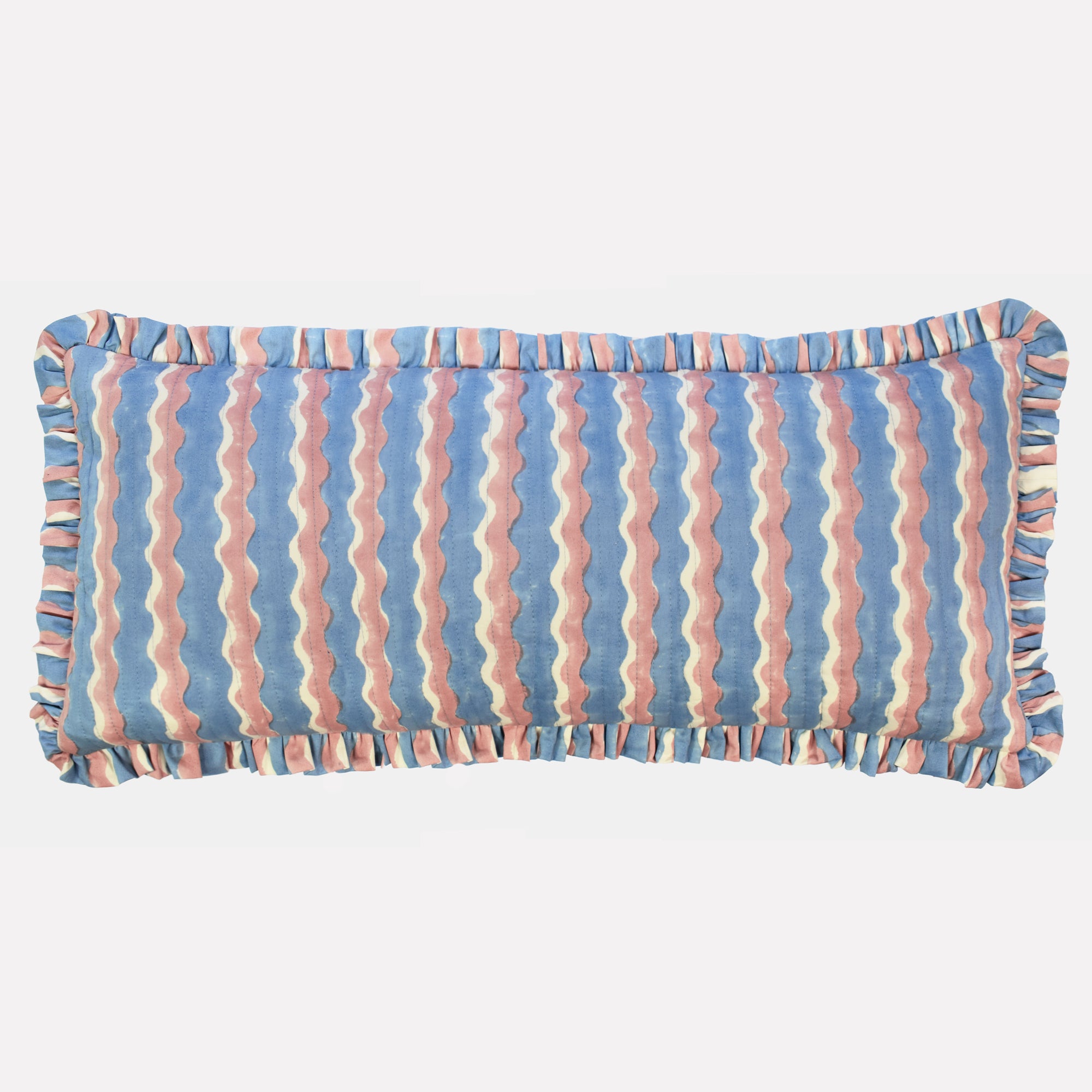 Long cotton quilted cushion printed with blue and pink striped wave pattern and frill border
