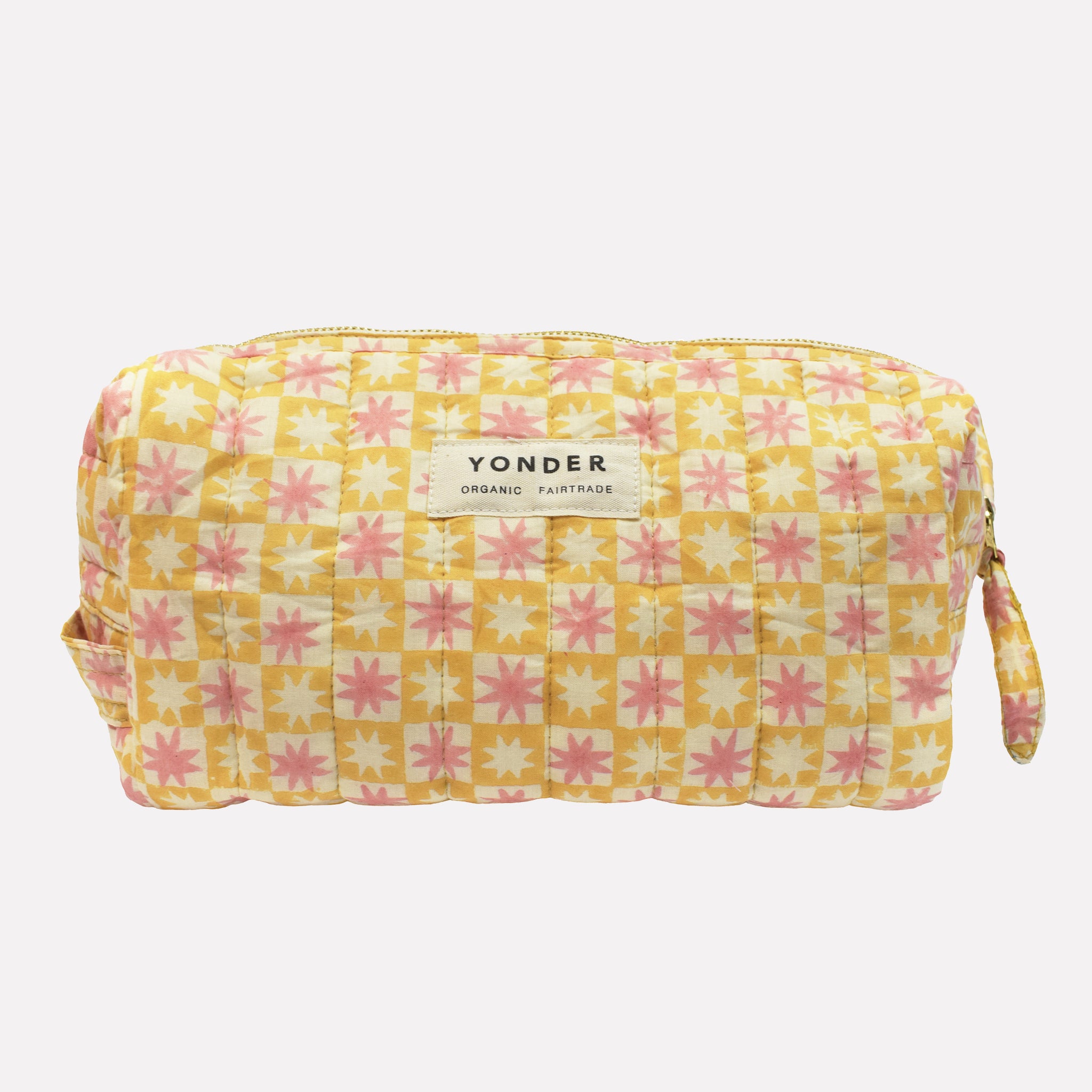 Cotton quilted wash/toiletry bag printed with yellow, pink, and white star pattern
