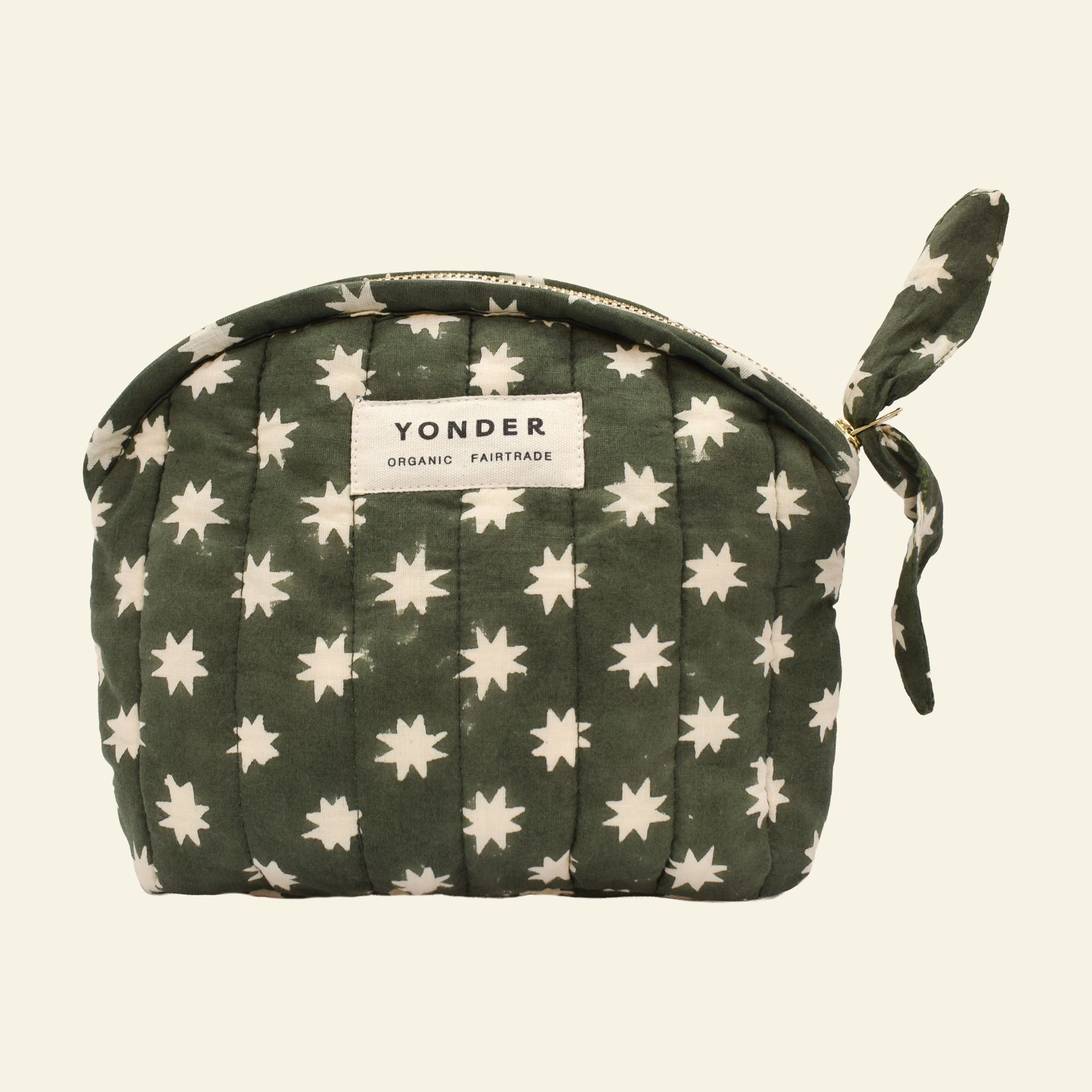 Yonder organic cotton quilted zip pouch in fern green Cosmic star print, with brass zip, hand block-printed in Jaipur