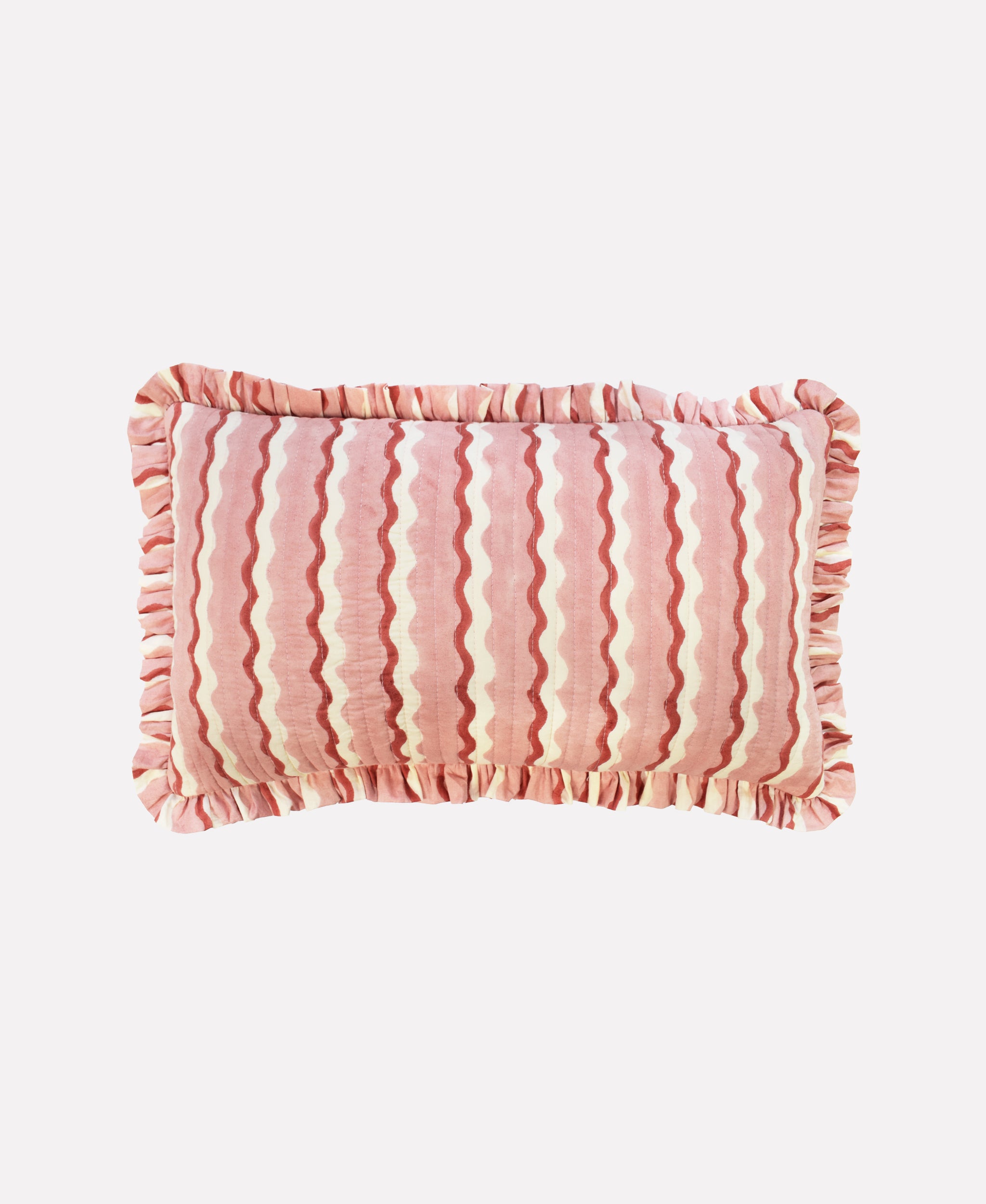 Small cotton quilted cushion printed with pink and white striped wave pattern and frill border